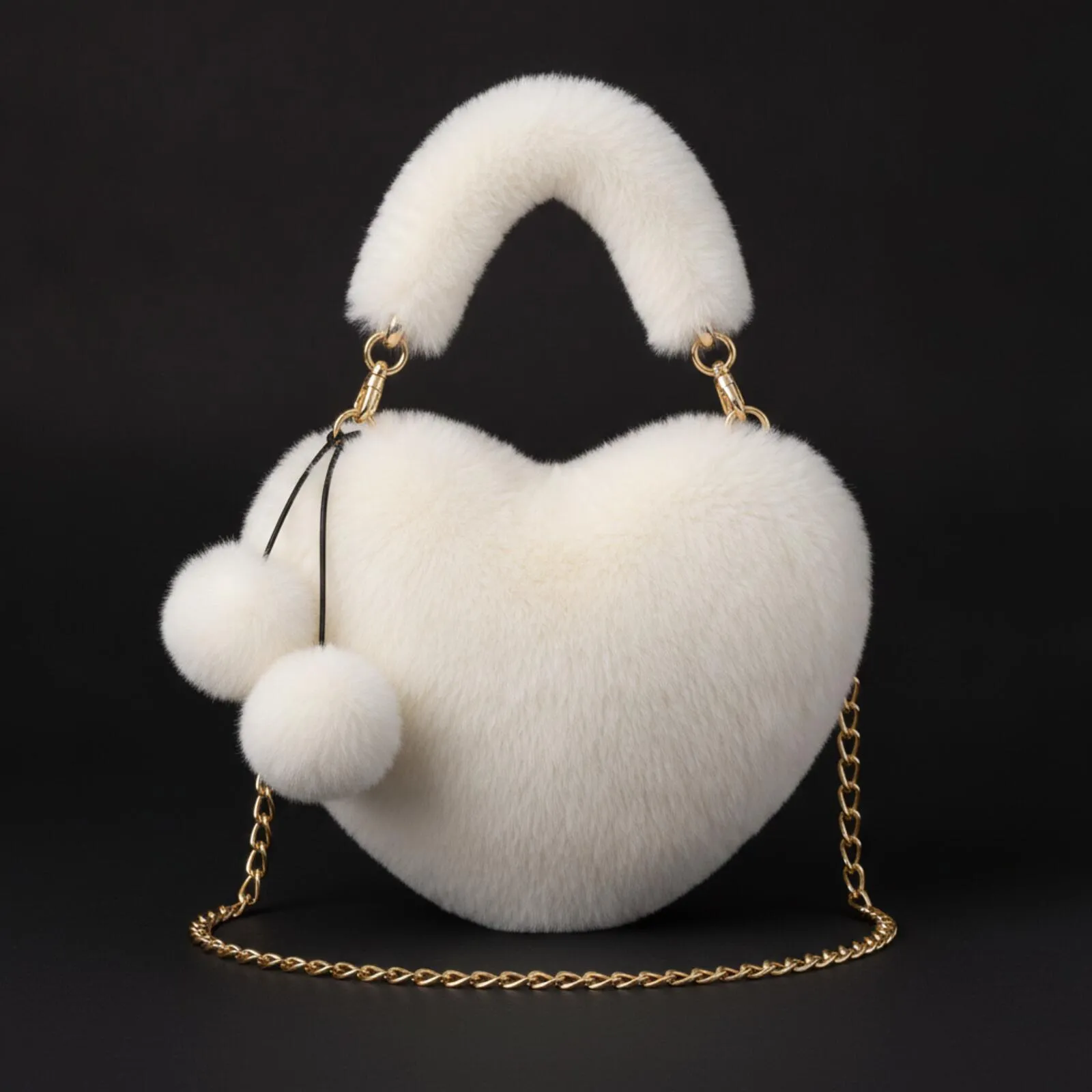 Cream heart-shaped faux fur crossbody bag with pom pom charms