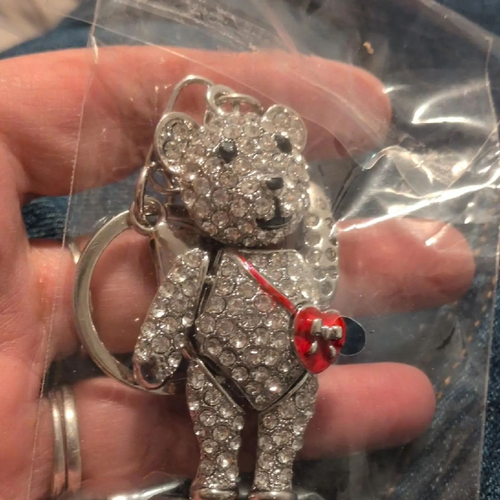 Sparkling gold-tone bear keychain with a red heart charm
