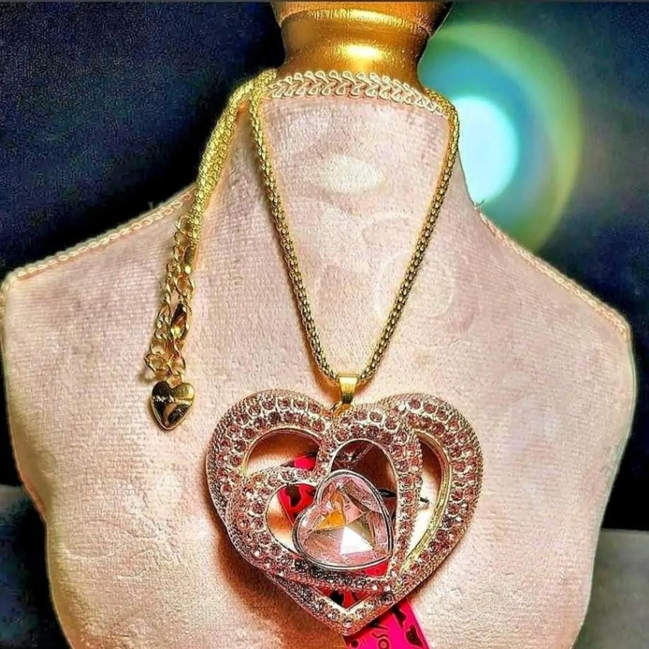 Gold-tone heart pendant necklace with a crystal accent