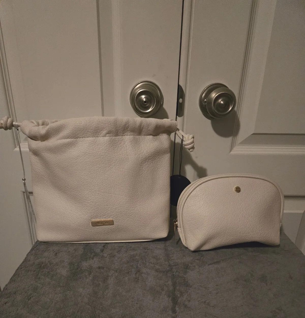 Cream vegan leather Nanette Lepore shoulder bag with a matching pouch