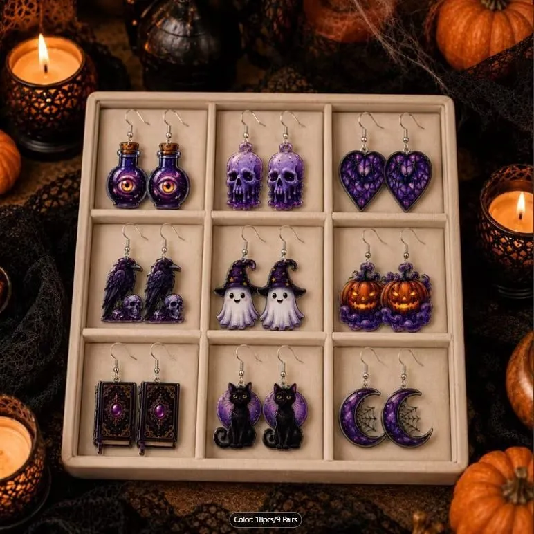 Nine pairs of purple Halloween earrings with pumpkins, ghosts, and skulls