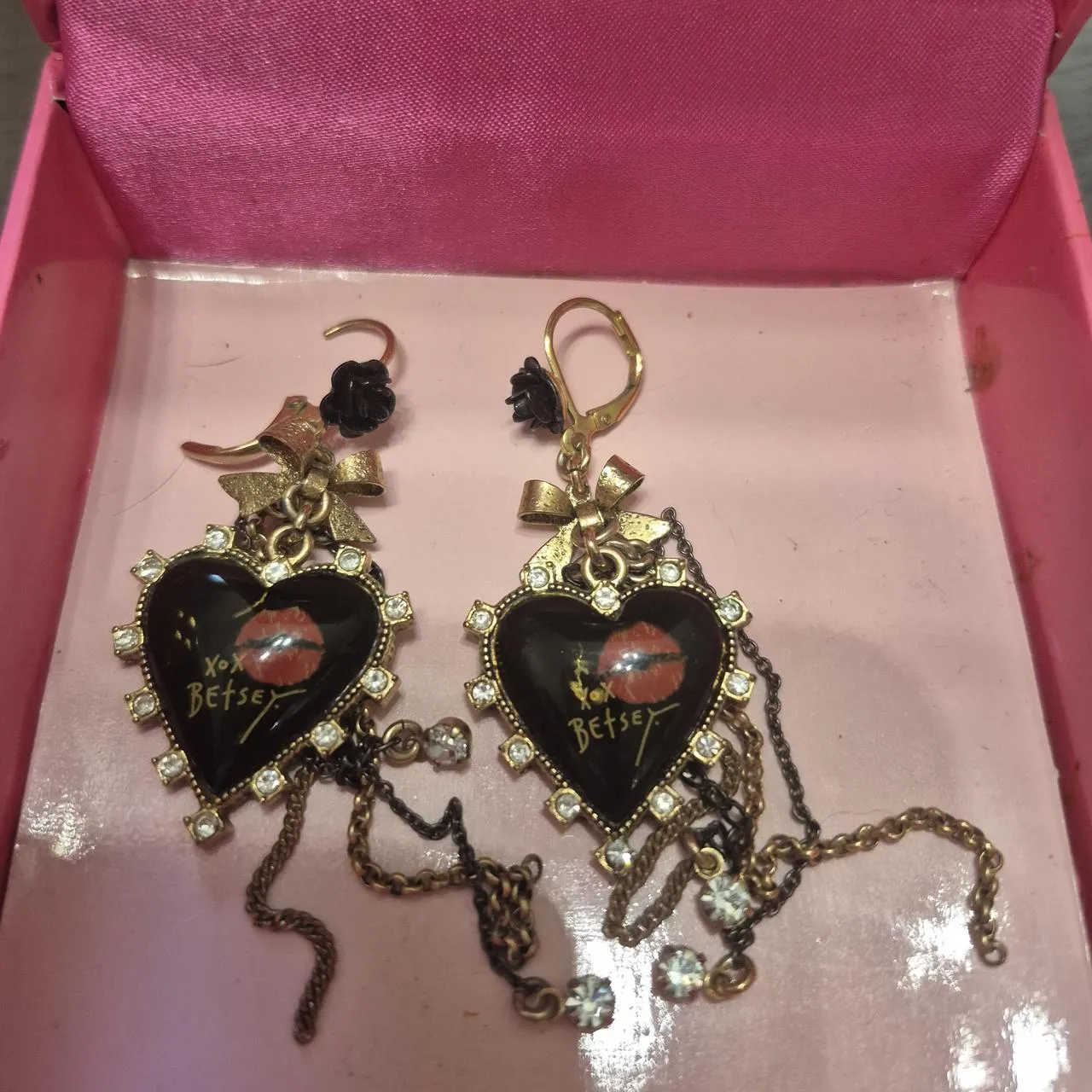 Black and gold Betsey Johnson heart earrings with chains and bow accents
